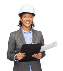 Image showing businesswoman in white helmet with clipboard