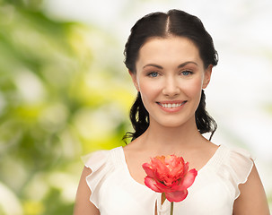 Image showing young and beautiful woman with flower