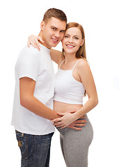 Image showing happy young family expecting child