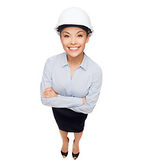 Image showing businesswoman in white helmet