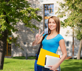 Image showing female student with bag, tablet pc and folders