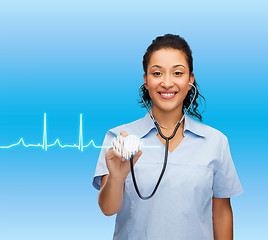 Image showing smiling female african american doctor or nurse