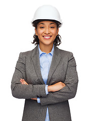 Image showing businesswoman in white helmet with crossed arms