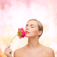 Image showing lovely woman with peonie flower