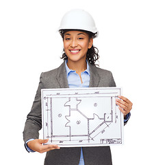 Image showing businesswoman in white helmet with blueprint