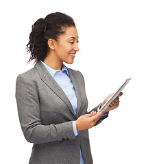 Image showing smiling woman looking at tablet pc