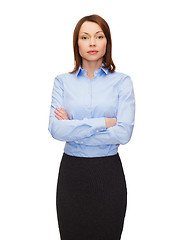 Image showing smiling businesswoman with crossed arms