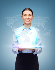 Image showing smiling businesswoman with blank tablet screen