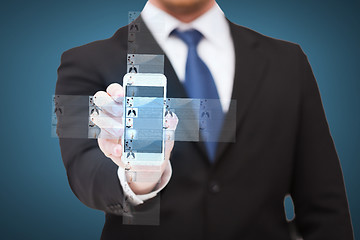 Image showing businessman showing smartphone with news on screen