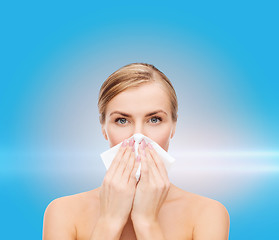 Image showing beautiful woman with paper tissue