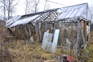 Image showing the old broken wooden greenhouse in a kitchen garden.