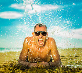 Image showing sexy young man at the beach