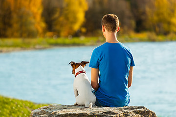 Image showing boy and dog 