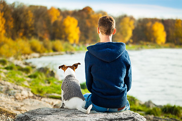 Image showing boy and dog 