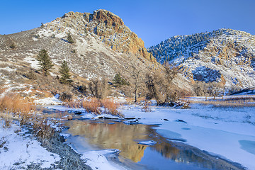 Image showing winter sunset over mountain river