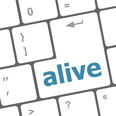 Image showing alive text on laptop computer keyboard key button