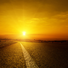 Image showing golden sunset over asphalt road