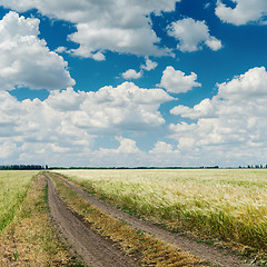 Image showing dramatic clouds over road in agriculture field