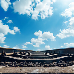 Image showing railroad to horizon and clouds in blue sky