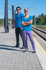 Image showing Two men standing on platform