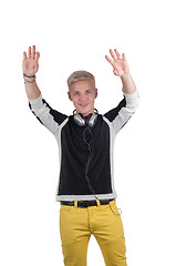 Image showing Man with headphones raising his hands up