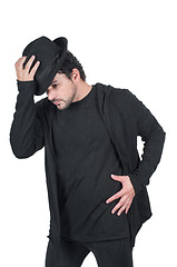 Image showing Man in black dancing with his hat