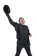 Image showing Young man with hat in hand yelling