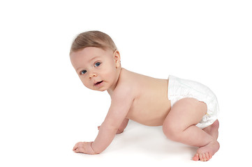 Image showing Side view of cute small crawling baby