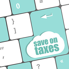 Image showing save on taxes word on laptop keyboard key, business concept