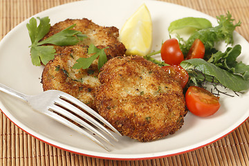 Image showing Homemade breaded fishcakes with a salad
