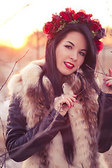 Image showing Winter girl with flowers