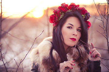 Image showing Winter girl with flowers