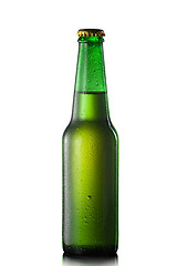 Image showing Beer bottle with water drops isolated on white