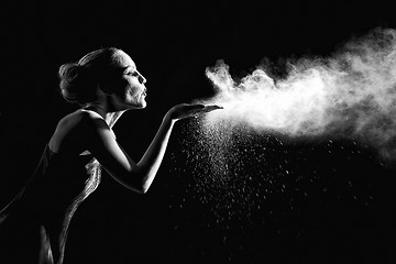 Image showing Woman With Stop Motion of Explosive Powder Captured by Flash