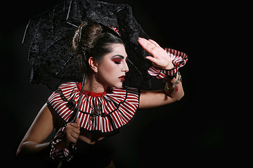 Image showing Woman Wearing Striped Fashion With Dramatic Lighting 