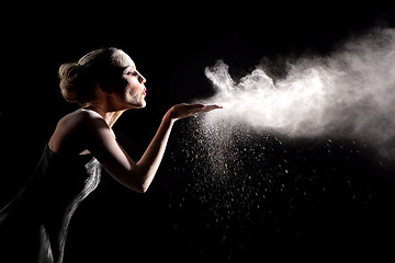 Image showing Woman With Stop Motion of Explosive Powder Captured by Flash