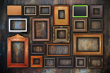 Image showing grunge wall full of old frames