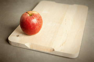 Image showing apple on wooden cutting board