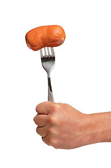 Image showing Sausage on fork