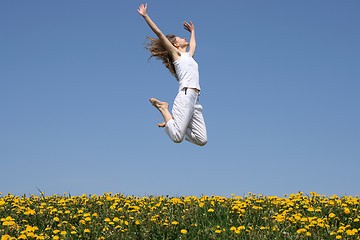 Image showing Girl in a happy jump