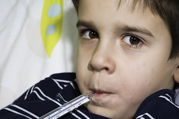 Image showing Sick child in bed.