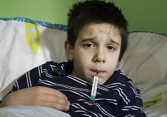 Image showing Sick child in bed.