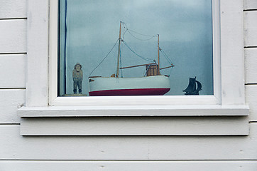 Image showing Fisherman in a window