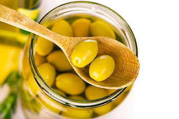 Image showing Close up green olives in bank