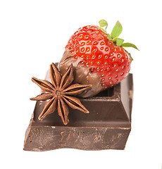 Image showing chocolate bars with its ingredients and strawberry