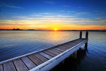 Image showing Setting sun behind the boat jetty, Lake Maquarie