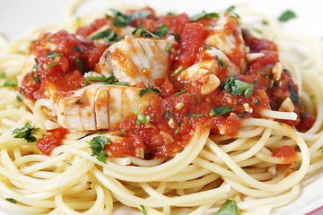 Image showing Spaghetti all'arrabbiata with fish side view