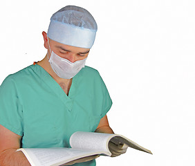 Image showing Surgeon reading