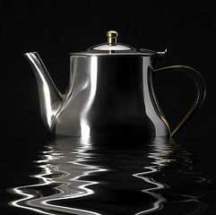 Image showing sinking metallic tea pot