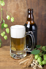 Image showing glass beer on wood background